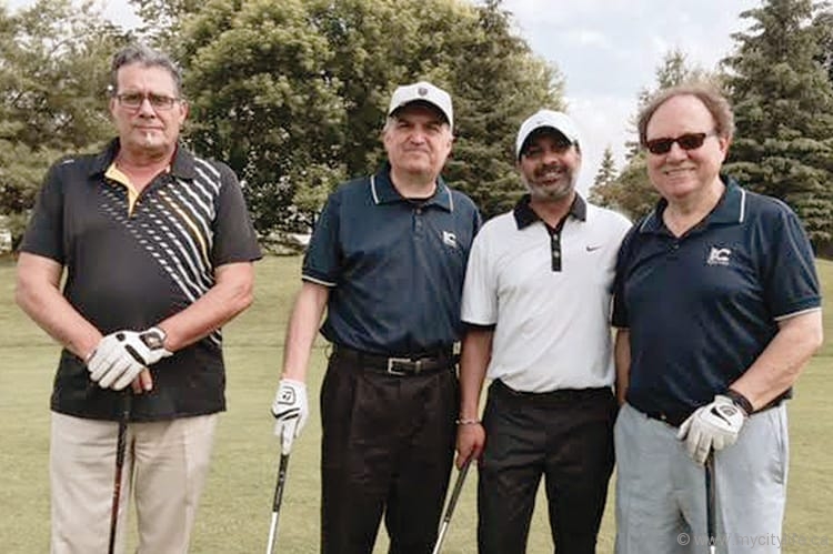 Fausto Gaudio (far right) with golfers