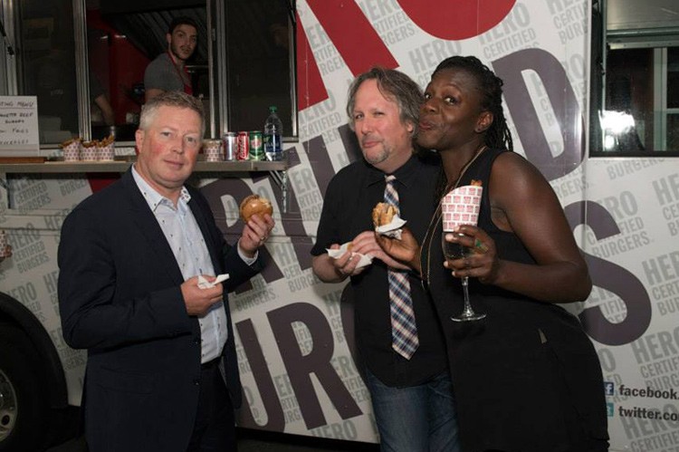 Left to Right: Bryan Snelson VP RBC Securities, Brad Barker (Radio Host), Garvia Bailey (Radio Host) enjoying food from the HERO burger food truck at the 2015 Panama Jazz Connection on July 23