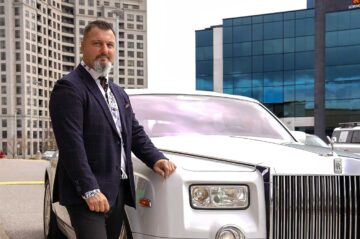 Rob Iafrate of A Celebrity Limousine Service standing beside a Limousine.