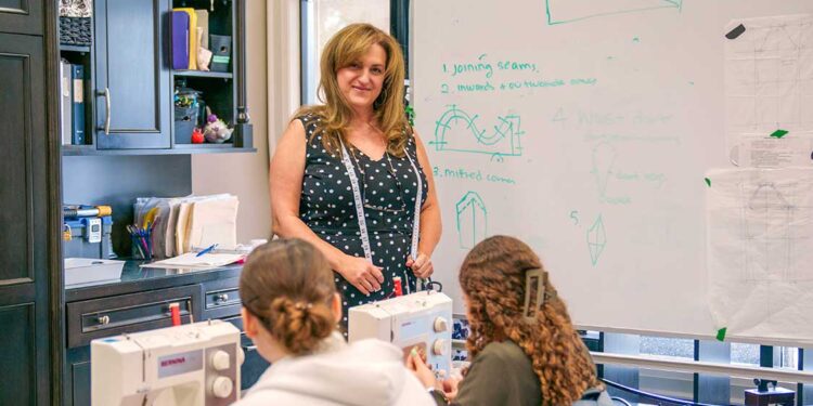 Joanne Dice of Haute Couture Academy of Fashion in her classroom with students.