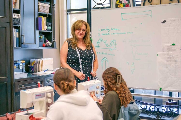 Joanne Dice of Haute Couture Academy of Fashion in her classroom with students.