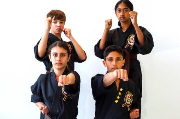 Children posing in Karate stances.