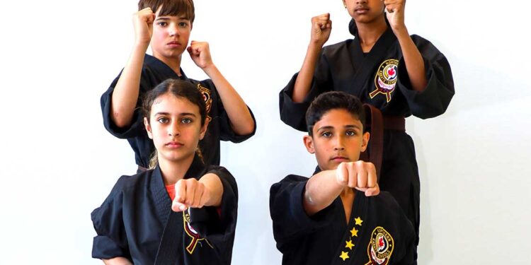 Children posing in Karate stances.