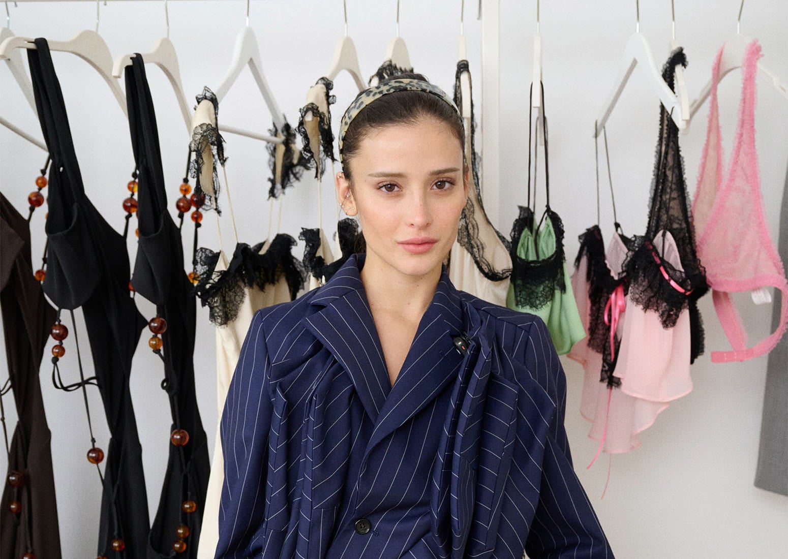 Marques stuns in an asymmetric pantsuit, shining in her signature style. | Photo Courtesy of H&M